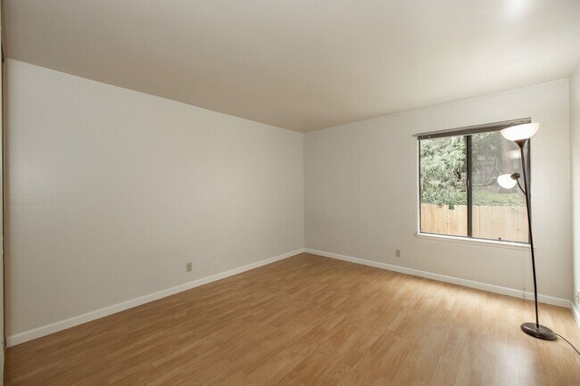 Building Photo - Peaceful Forest-View Condo with Fireplace & Private Balcony in Golden Oaks