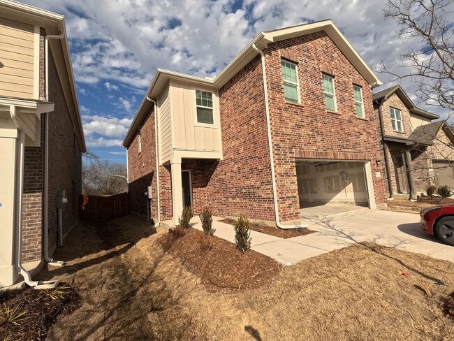 Building Photo - This home features four spacious bedrooms,...