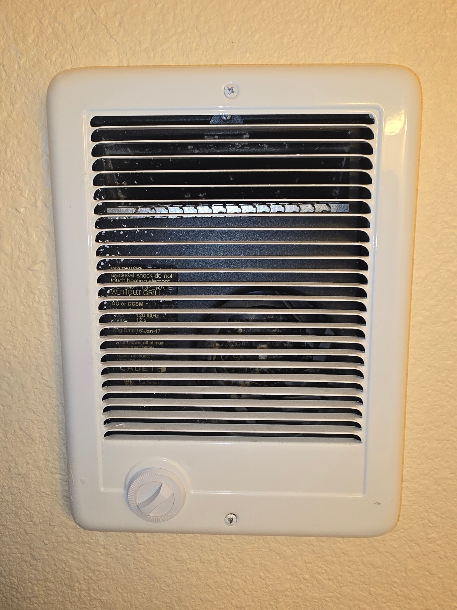 Wall-mounted electric fan heater provides plenty of heat in the bathroom when getting out of the hot tub bathtub or shower - 3622 Wild Oats Ln