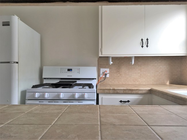 Kitchen with new stove - 2 62nd Pl