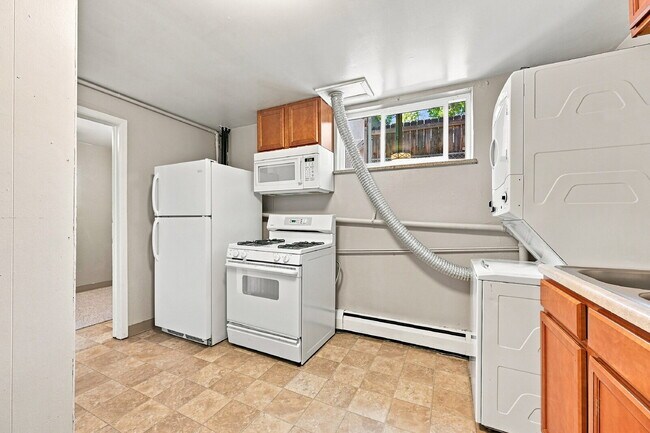 Building Photo - AVAILABLE NOW  Spacious 4-Bedroom Wheat Ridge Home with Finished Garden Level, Two-Car Garage & B...
