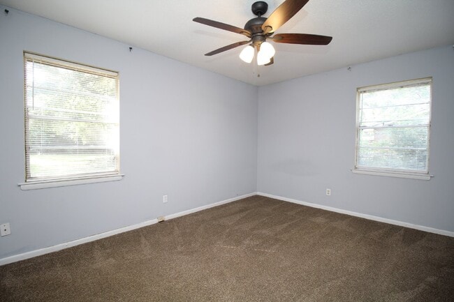 Building Photo - Spacious 3BR/1.5BA Home in Pace with Open Living Area, Tiled Family Room, and Fenced Backyard – M...