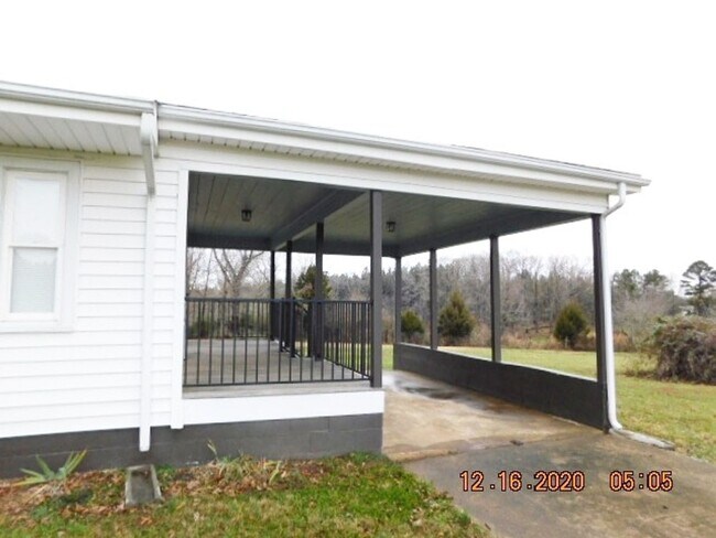 Building Photo - Home with 2 bedrooms, 1 bath, side deck, carport with side porch and detached garage