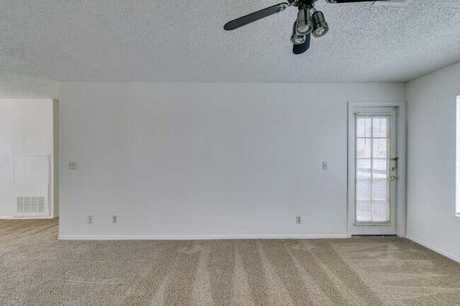 Building Photo - Charming Second-Floor Condo with Two Bedrooms and Fireplace