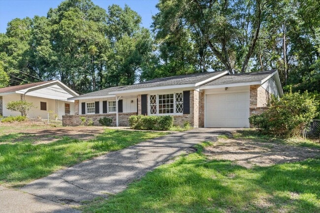 Building Photo - Three bedroom home close to USA with a garage
