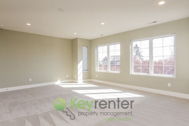 Building Photo - Spacious Living with Balconies, Deck, and Private Yard