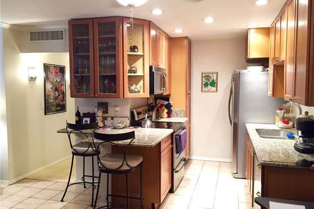 Remodeled kitchen with extended granite countertops and cupboards - 436 N Bellflower Blvd