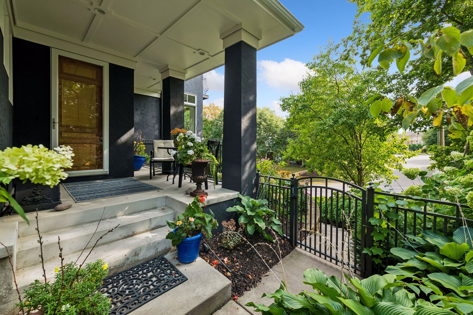 Lovely front porch area to greet guests or unwind - 745 Rice St E