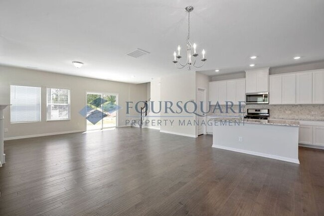 Building Photo - End-Unit Townhome with Loft, Open Floor Plan & Patio, Conveniently Located Near Dining, Shopping,...