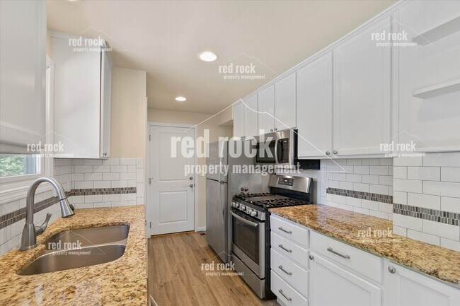 Building Photo - 2211 E 49th Ave