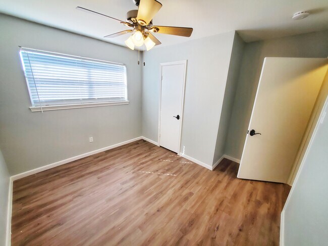 Bedroom 3 has a walk-in closet and ceiling fan. - 37438 Meadowview Dr