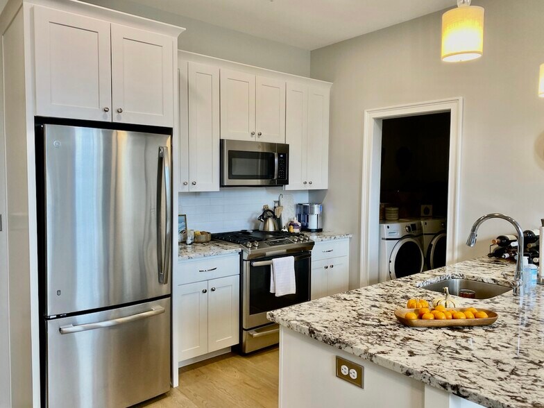 kitchen and laundry room entry - 77 Van Dam St