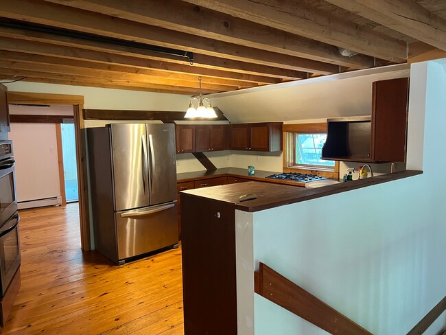 Kitchen Range and Fridge Visible over looking Dishwasher - 18 Maple Ave