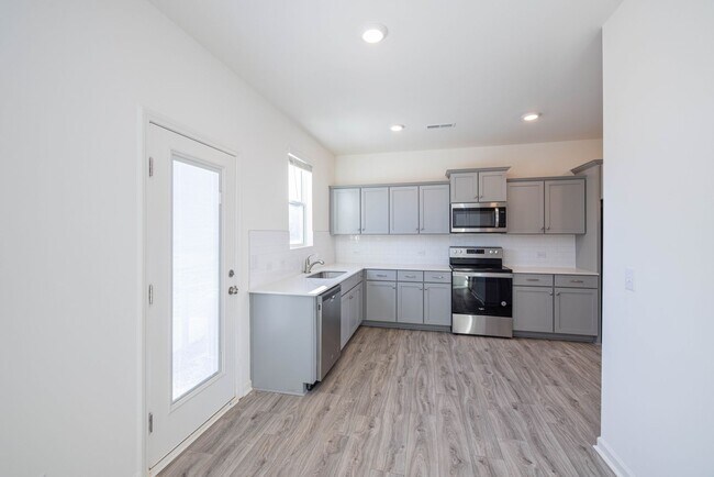 Building Photo - 3 Bedroom Townhome Minutes from Downtown Oakboro - Available August 2026