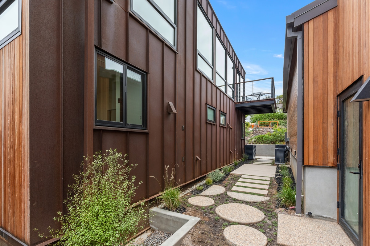 Patio space in between homes with custom yoga pad. - 4638 Del Monte Ave
