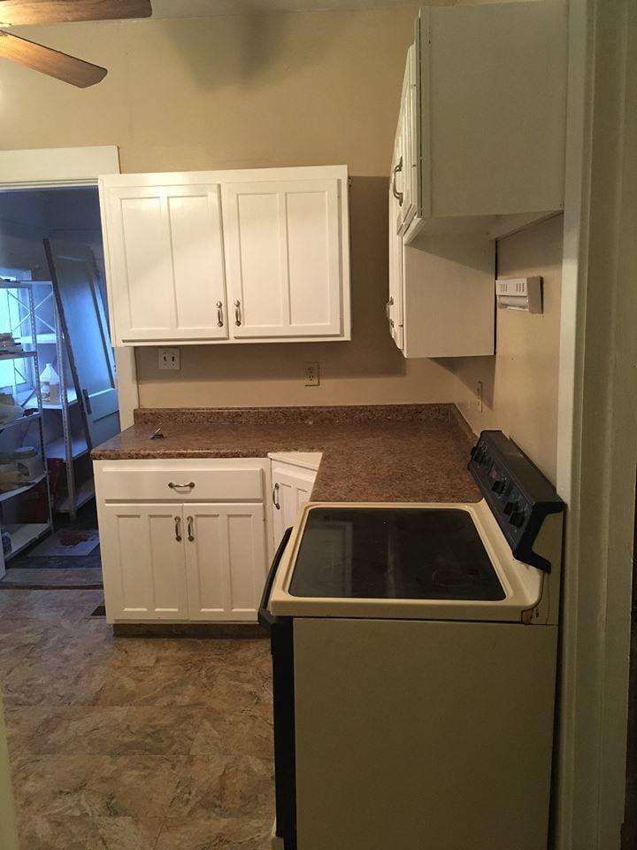 Electric range/oven. Also shows rear Porch area (no access to outside) which makes for a great 10x7 pantry. - 1545 S 13th St