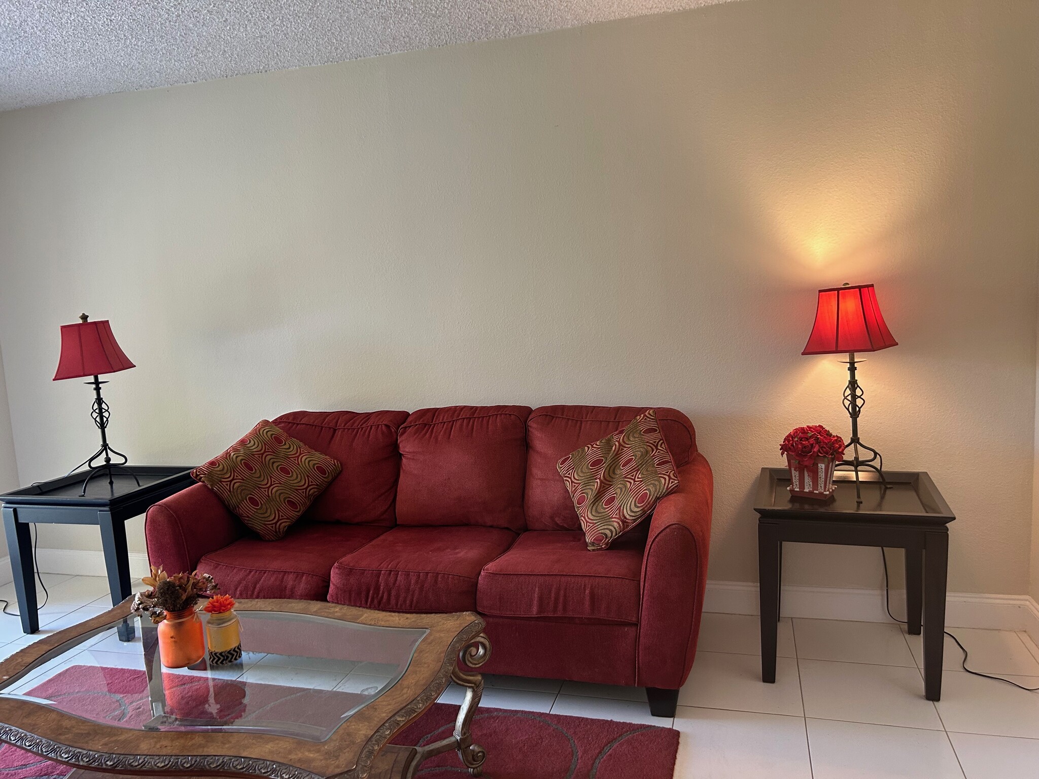furnished living room with matching sofa and loveseat - 470 NW 20th St