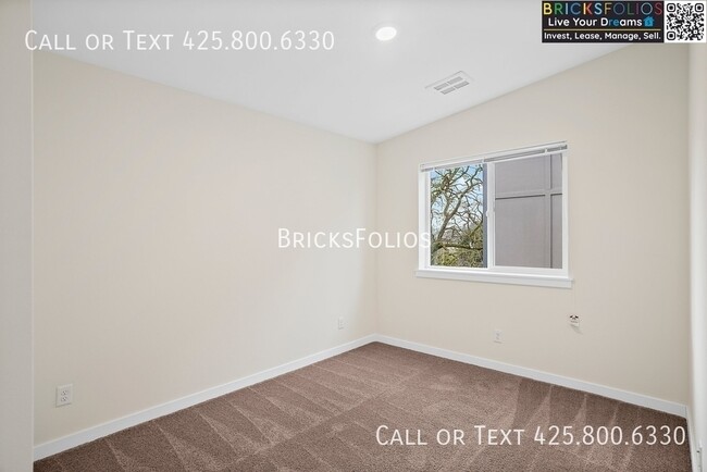 Building Photo - Near JBLM – Stylish, Comfortable, and Move...