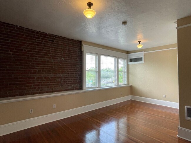 Building Photo - Urban DREAM! Spacious 1-Bedroom w/ Exposed Brick, Fireplace, & More in a Hip Location!