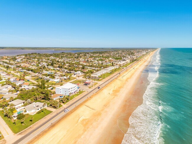 Building Photo - Luxury Oceanfront Living – Fully Furnished...