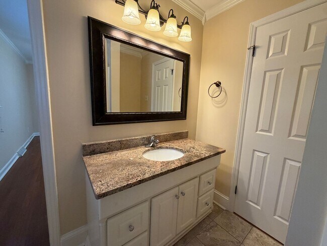 Building Photo - Freshly Painted Split-Level Home with Large Deck & Lawn Care Included