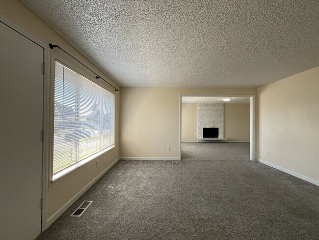 Building Photo - Charming Ranch Home with Sunroom or 4th Bedroom, Two-Car Garage and Fenced Backyard