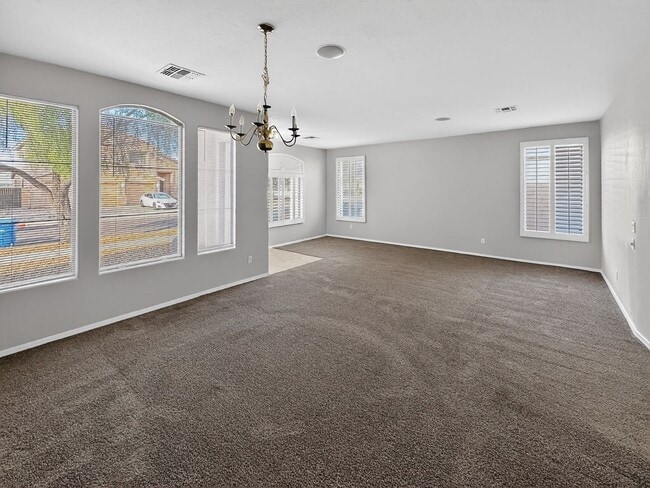 Building Photo - Single-level 4 bed, 2 bath home with tandem 3-car garage and RV gate.