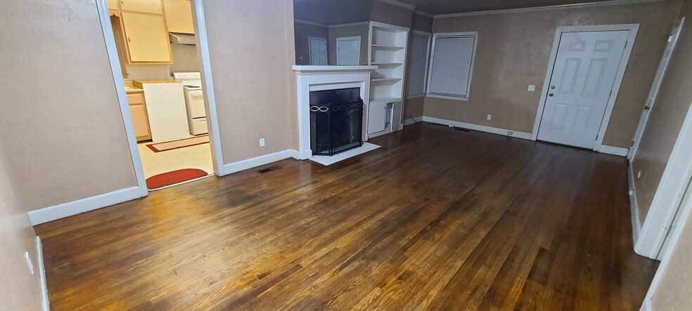 Living room with fireplace. - 299 N Lexington St