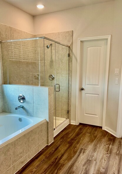 The master bath also features a stand up shower, soaker tub and separate water closet. - 509 Turtle Dove Dr