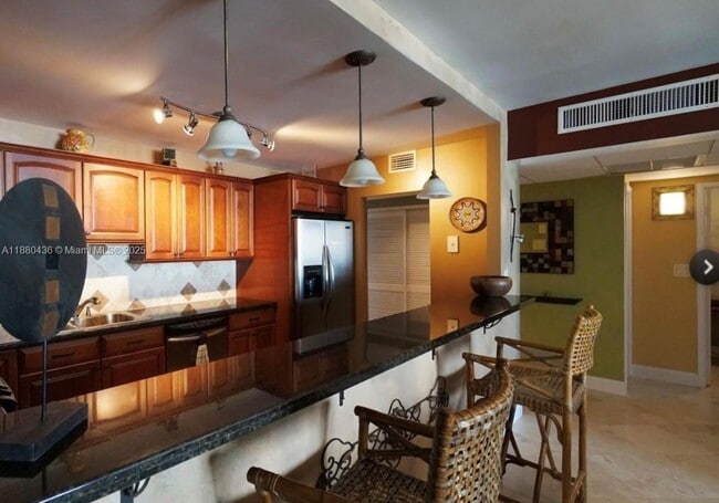 Building Photo - 19370 Collins Ave