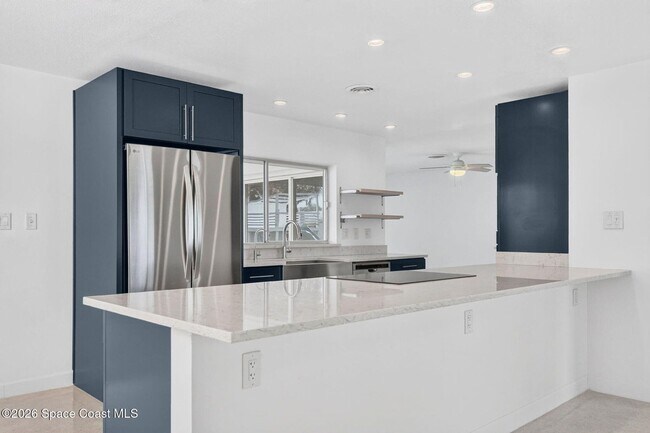 Building Photo - Welcome to this beautifully remodeled 4-bedroom, 3-bath home in the heart of Indialantic Beach!