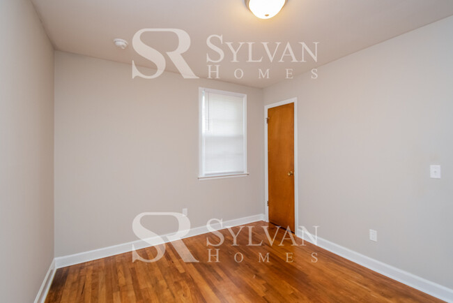 Building Photo - Welcome to this charming abode.