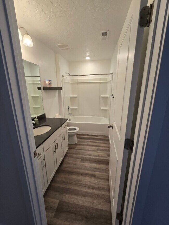 Building Photo - Nearly New, Well Appointed Modern Townhouse w 2 car attached garage