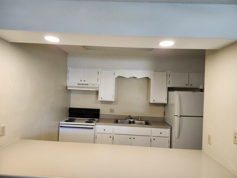Kitchen with refinished cabinets and counter top - 27 6th St
