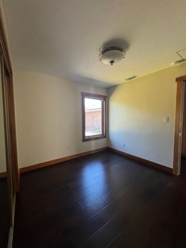 Building Photo - Artisan-Built Custom Cottage Retreat | Private Yard, Garage & EV Charging Ready