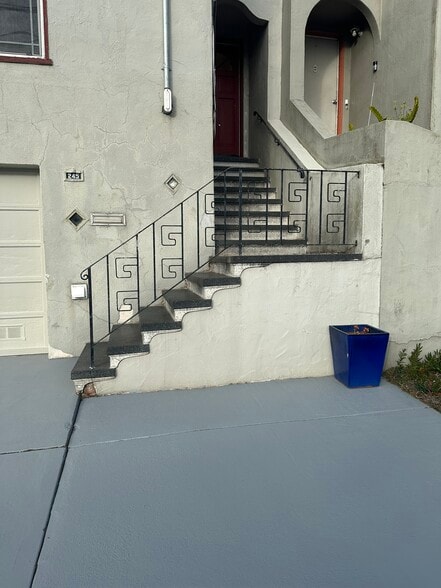 Outside view with staircase to front door - 245 Concord St