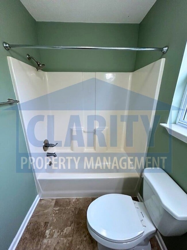 Building Photo - Three bedroom with attached garage!