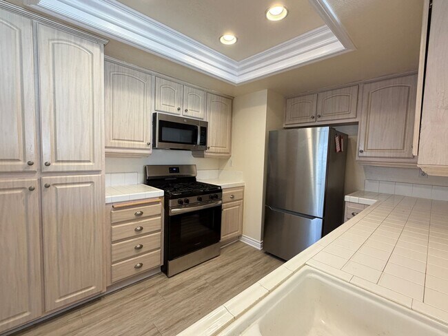 Building Photo - BEAUTIFULLY REFRESHED UPPER-LEVEL CONDO WITH GARAGE & RESORT-STYLE AMENITIES