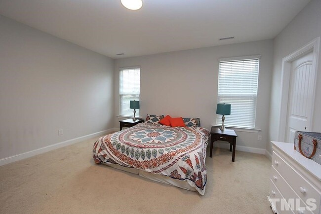 Building Photo - Main Floor Owner's Suite PLUS Main Floor G...