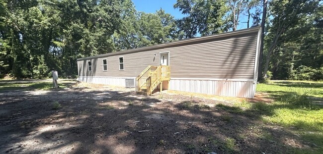 Building Photo - Brand new 4BR Mobile Home - Country living with City convenience!