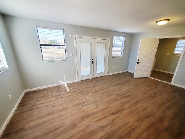 Gorgeous sunroom is accessible from the utility room or living room. French doors to the backyard. - 37438 Meadowview Dr