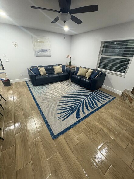 Family room with fireplace - 11936 W Waterway Dr