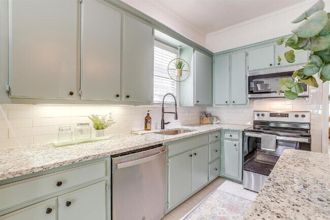 Building Photo - Charming 2-Bed, 2-Bath Gem with Granite Co...