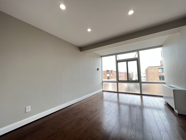 Bedroom with espresso solid hardwood floors - 730 24th St NW