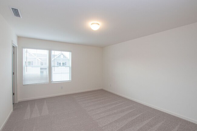 Building Photo - 3 Bedroom paired home with 2 car garage mi...