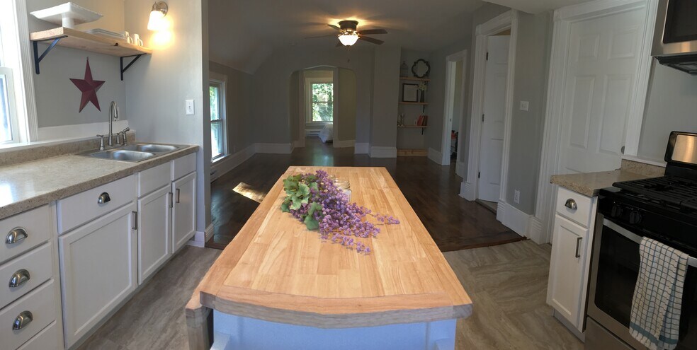 Enjoy the open concept floor plan as the kitchen flows into the living room. - 1927 Washington Street Northeast