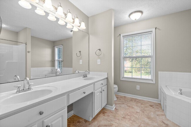 Building Photo - Pet Friendly Three Bedroom with Bonus!