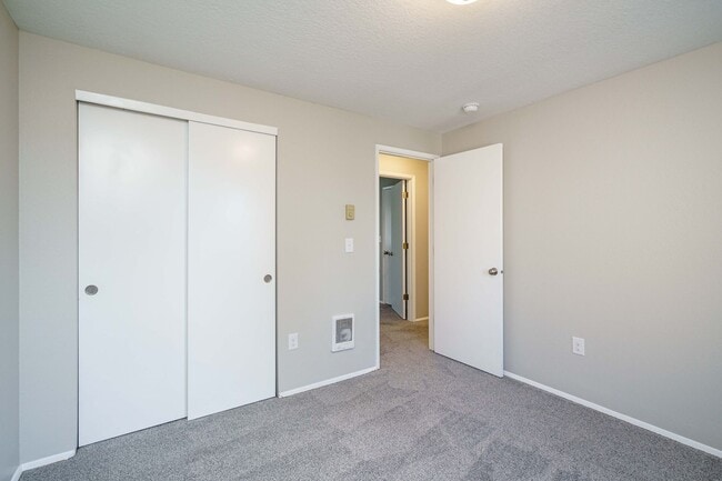 Building Photo - Recently Updated with Wood Laminate Flooring and Fresh Paint