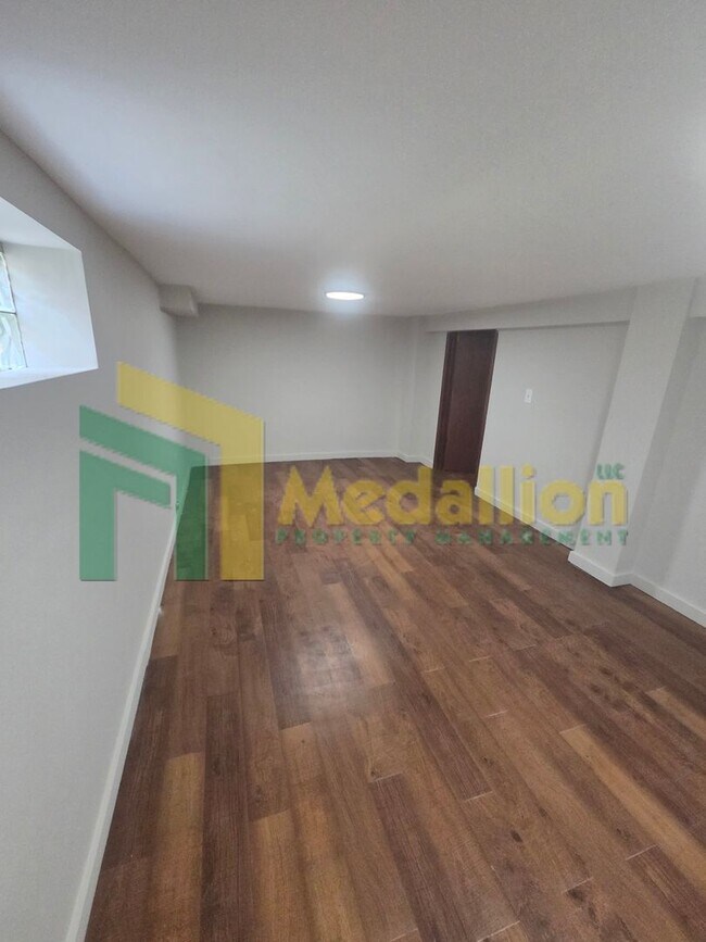 Building Photo - Spacious 6-Bedroom Home with Finished Basement and Backyard