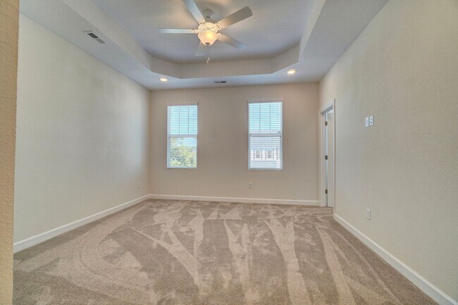 Building Photo - Available 08-05-25! Coastal Luxury Townhom...